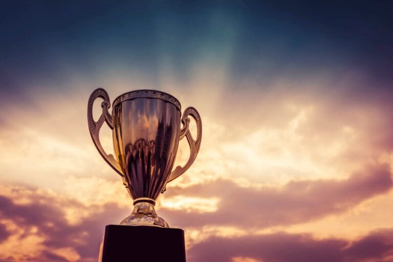 A trophy in front of a beautiful sunset - image